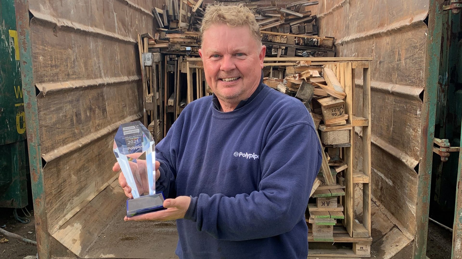 Polypipe Building Services recycling operative Paul Knight with the Recycling Award from Wolseley