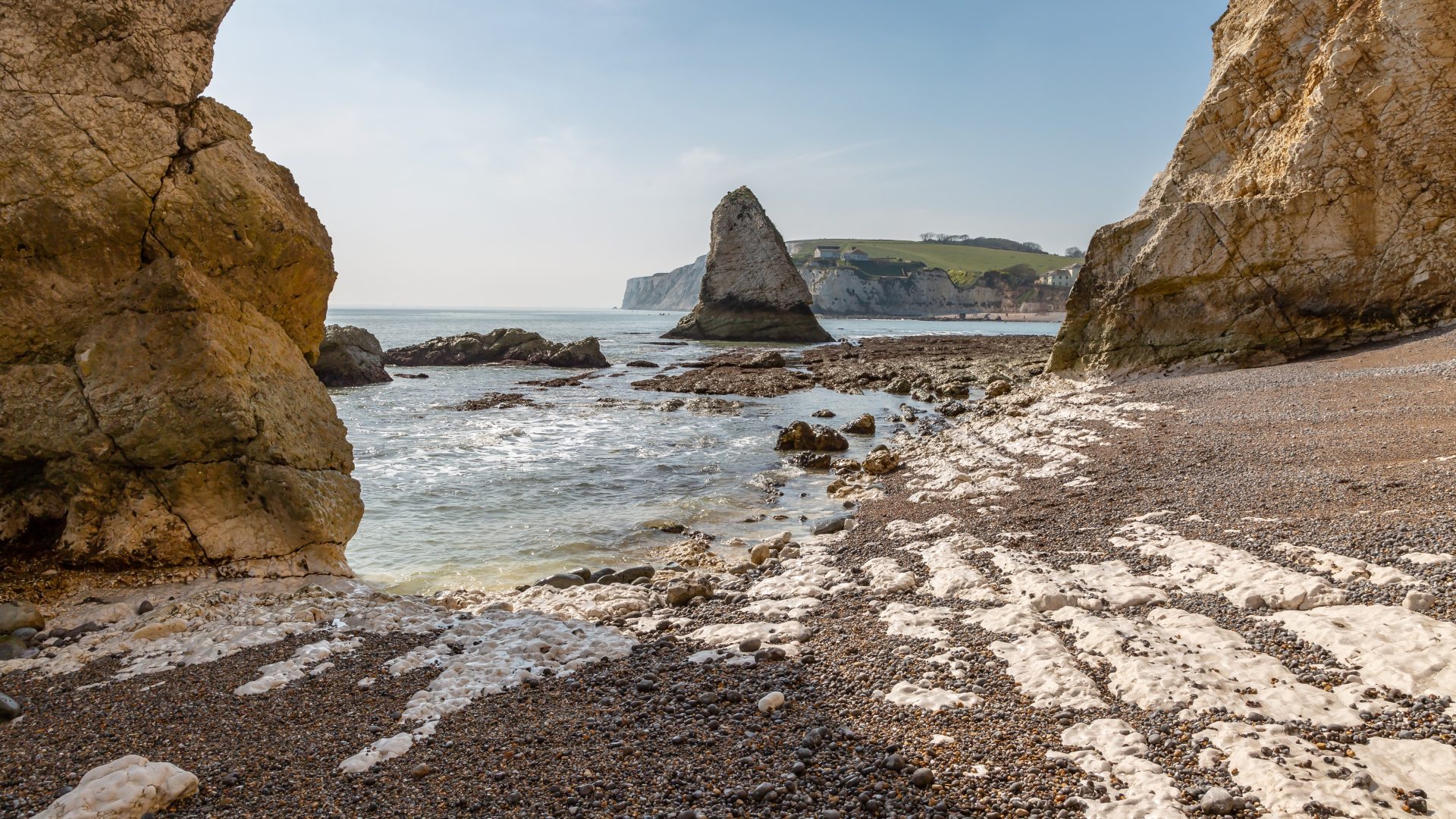 Low tide at rocky Freshwater Bay on the Isle of Wight, on a sunny spring day