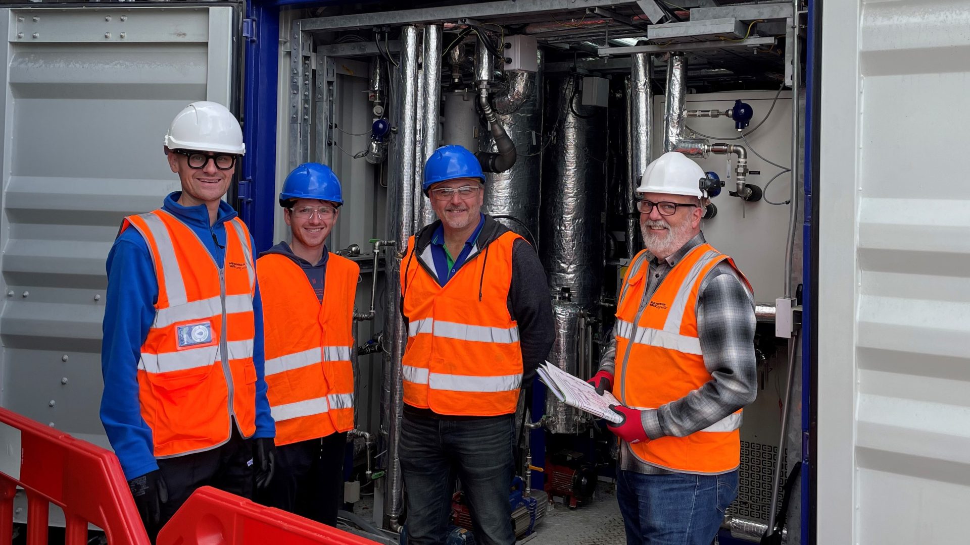 Teams from Northumbrian Water and Organics in front of the ammonia stripper.