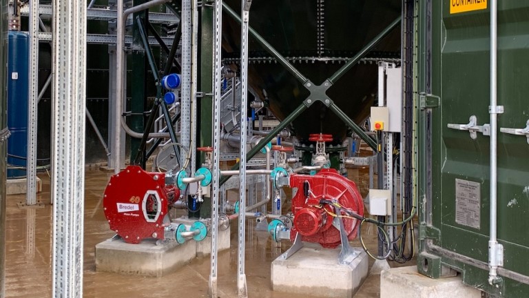 Two Bredel hose pumps transferring sludge at the newly-opened water treatment plant at South Crofty tin mine in Cornwall, England.
