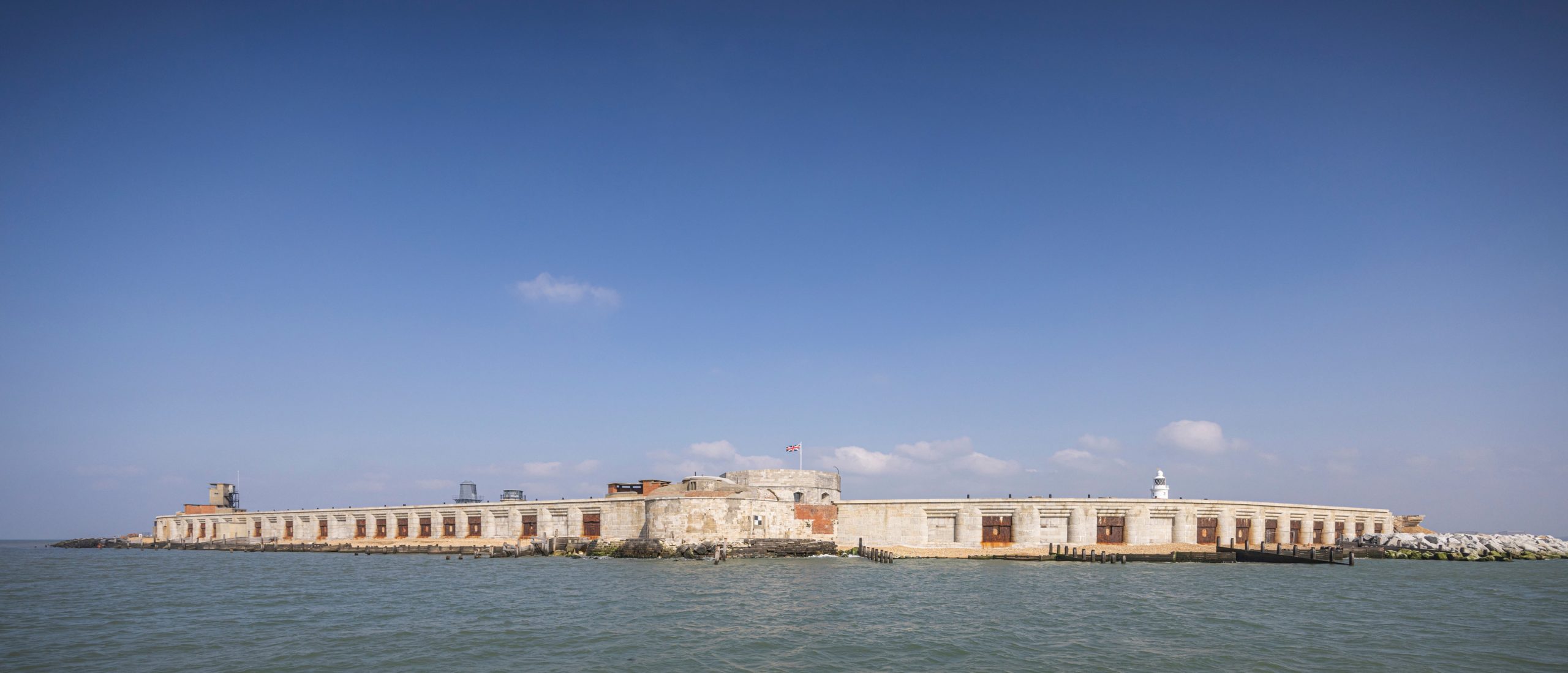 A view of Hurst Castle in Hampshire showing both the east and west wings with the Tudor keep in the centre, seen from the sea.Photograph by Christopher Ison for English Heritage © chris@christopherison.com