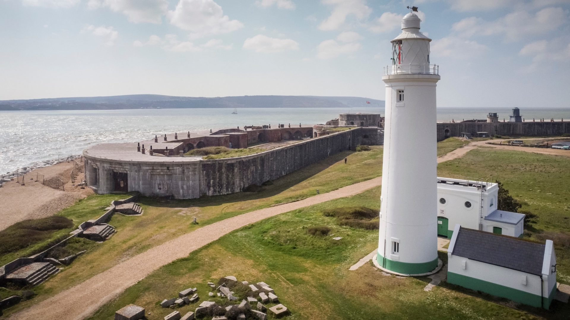 An aerial view of the lighthouse and Hurst Castle in Hampshire looking south to the Isle of Wight. Photograph by Christopher Ison for English Heritage ©