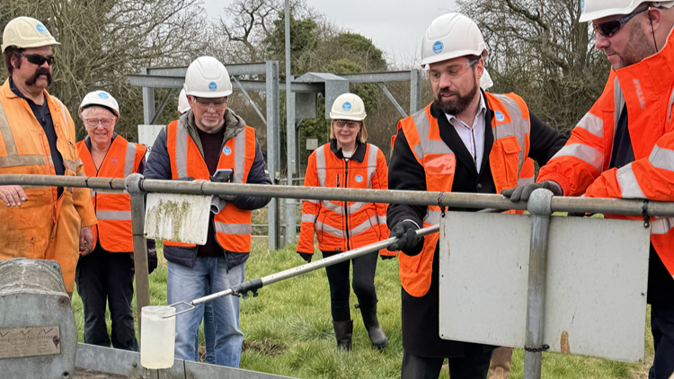 Sean Woodcock MP taking samples of final effluent at Banbury STW