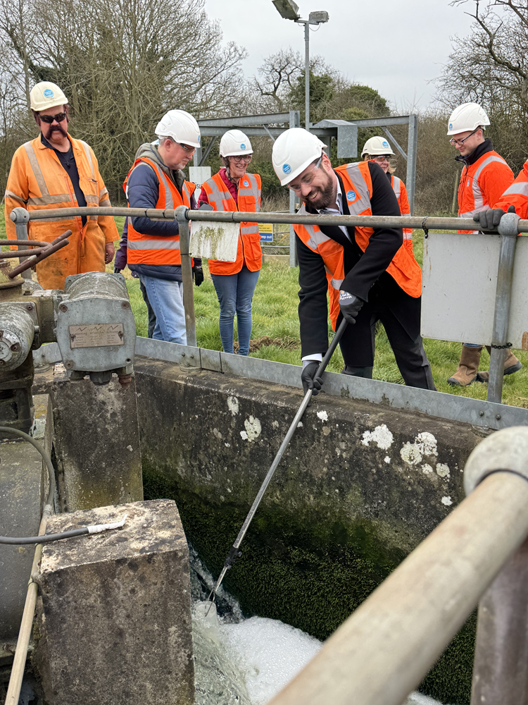 Sean Woodcock MP taking samples of final effluent at Banbury STW